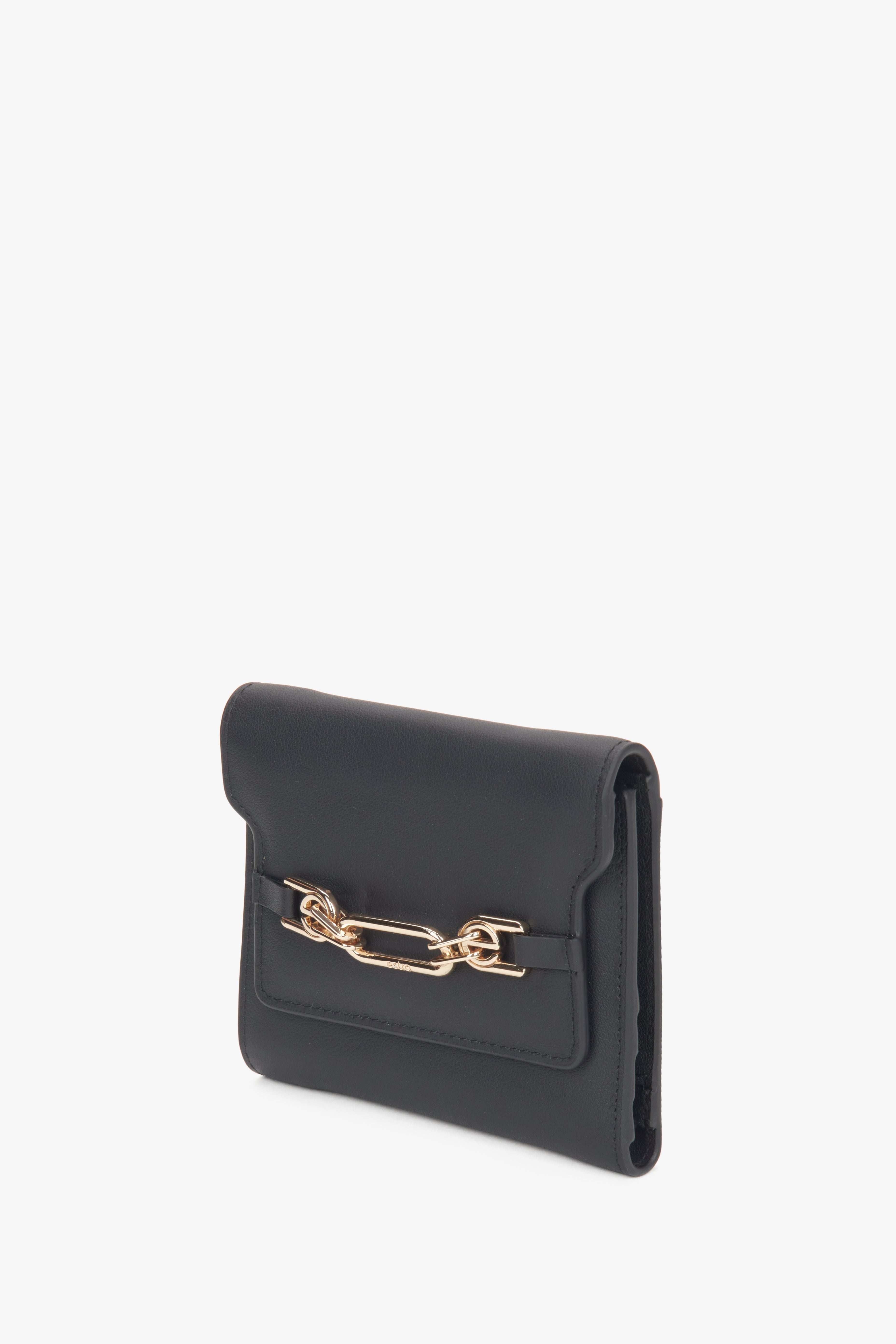 Women's black leather wallet with a gold clasp, Estro.