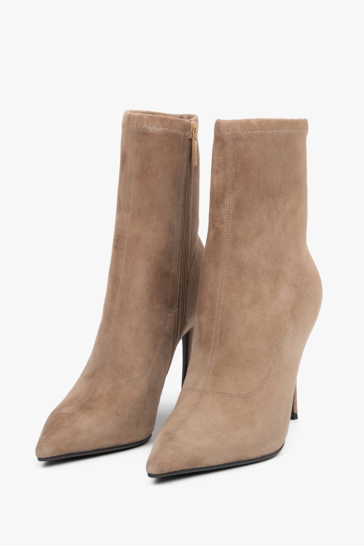 Beige women’s ankle boots with stretch shaft on high stiletto heel.