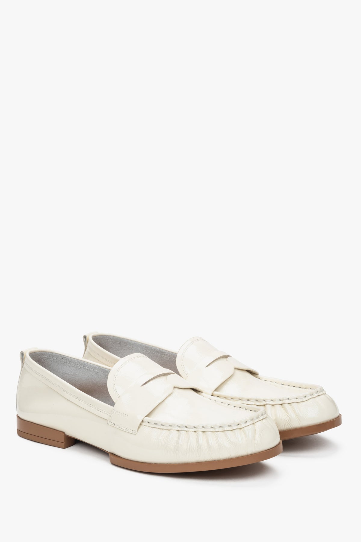 White patent leather women's loafers made of genuine leather by Estro.