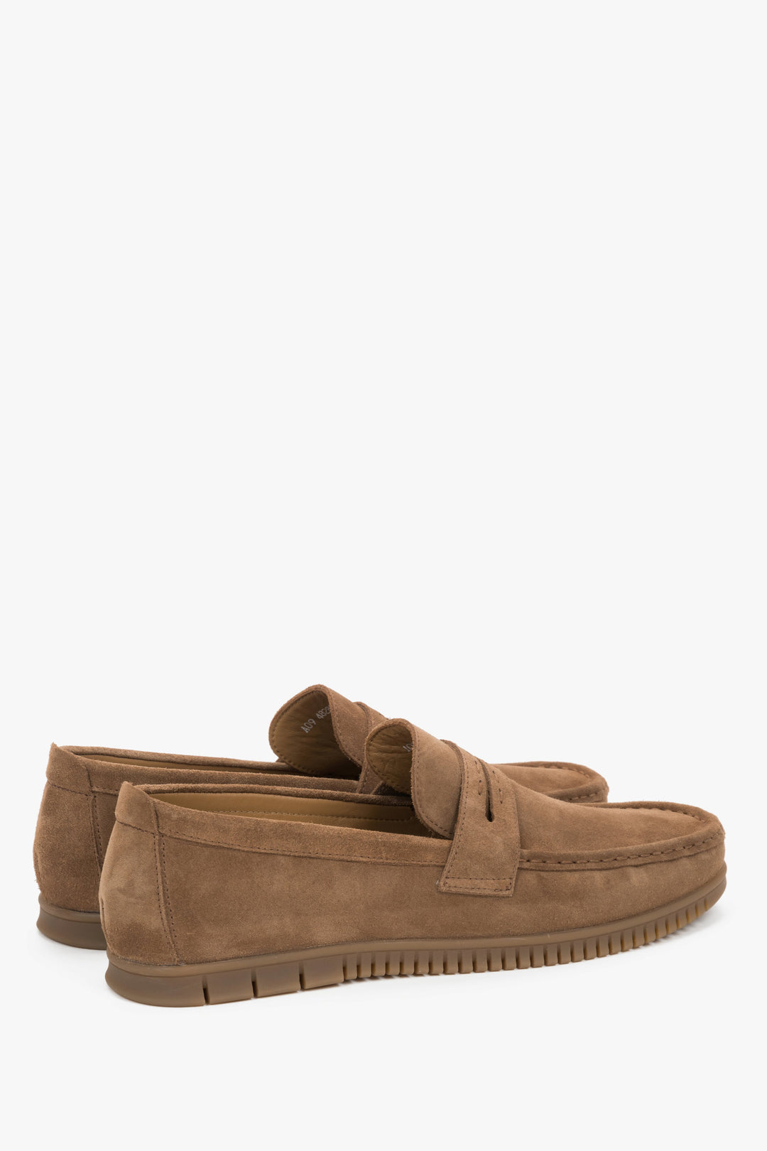 A man wearing caramel Italian velour loafers paired with casual trousers, showing a smart-casual look.