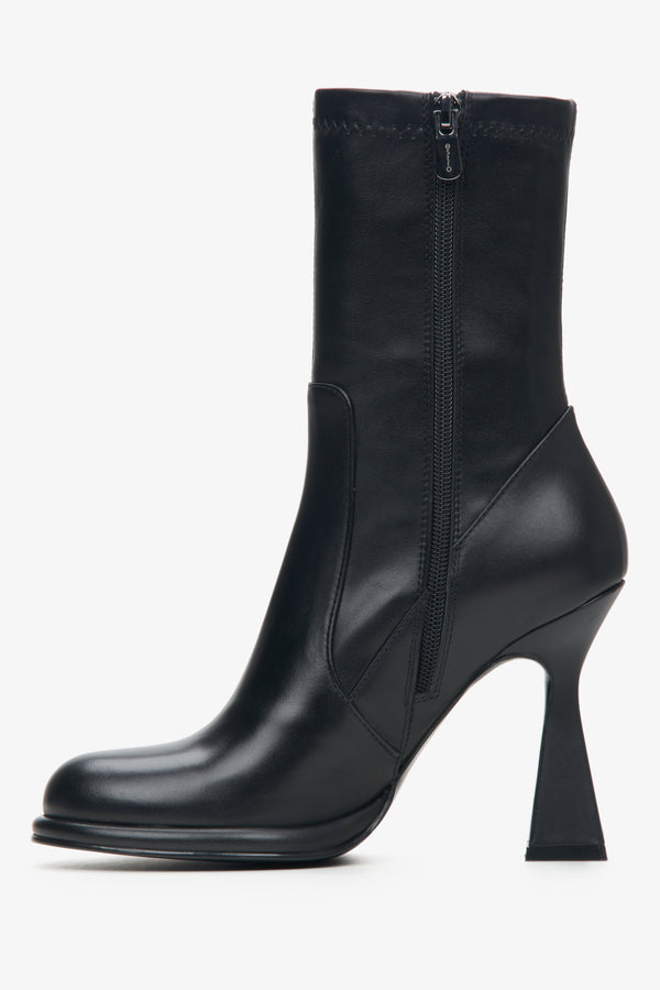 Women's black ankle boots with funnel heel made of genuine leather by Estro - close-up on the shoe profile.