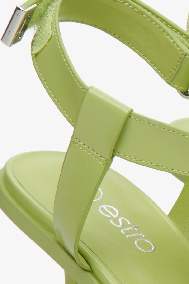 Women's light green T-bar strappy sandals - slose-up on buckle and straps.