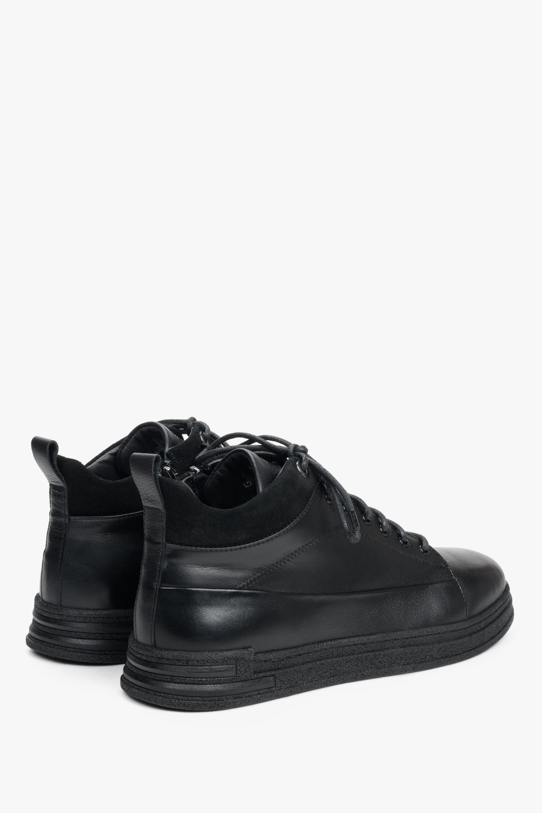 High-top black men's sneakers made of genuine leather by Estro with a zipper - close-up on the heel of the shoe.