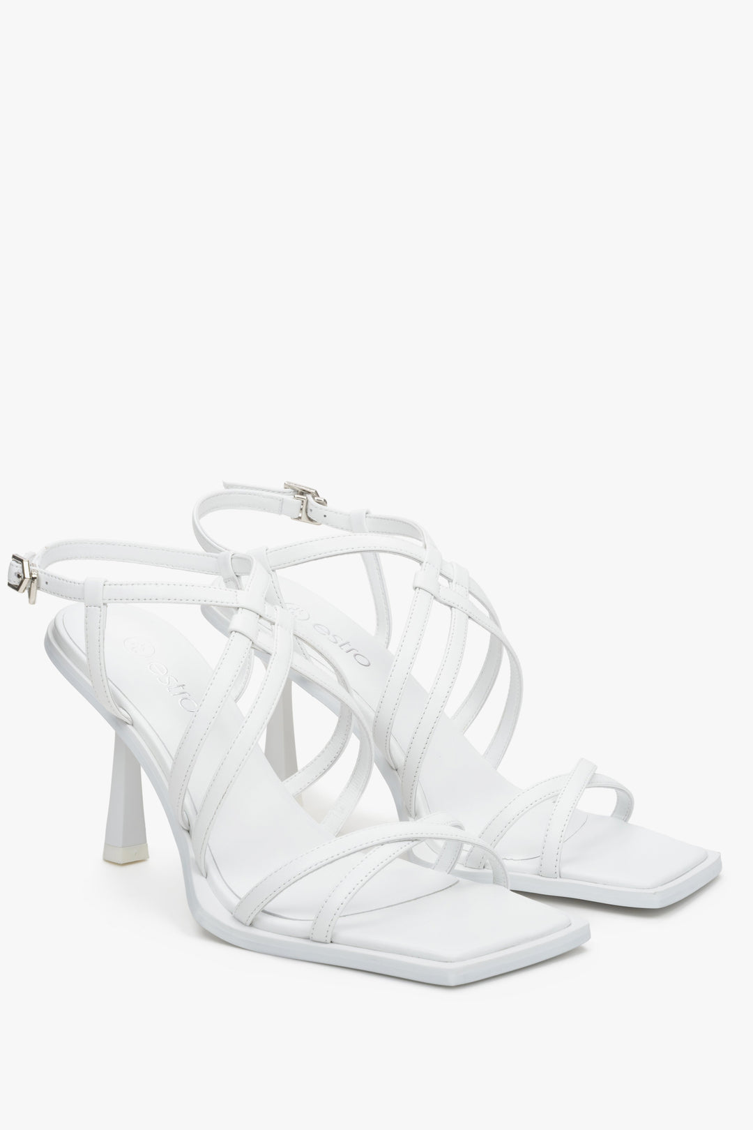 White women's strappy sandals on a funnel heel, Estro brand.