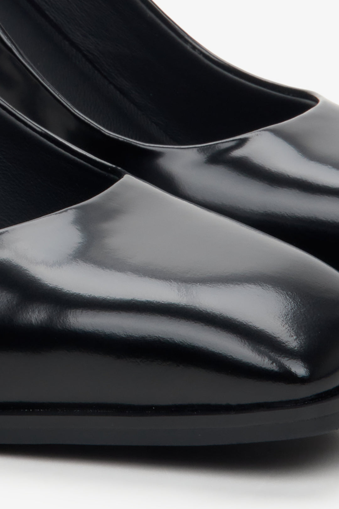 Women's leather high-heeled shoes - close-up on details.