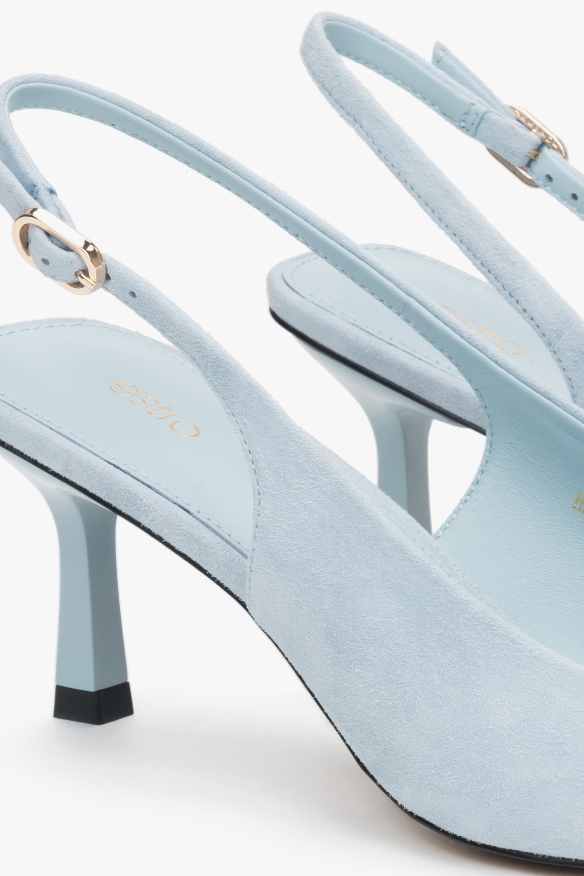 Light blue velour slingback pumps with a low heel by estro – close-up on details.