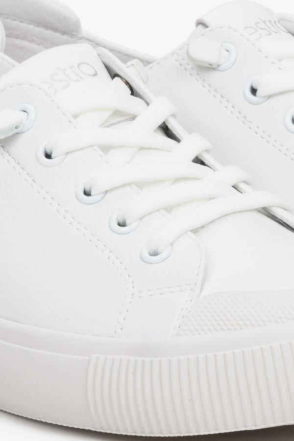 Women's white leather sneakers by Estro with laces for spring - close-up on the details.