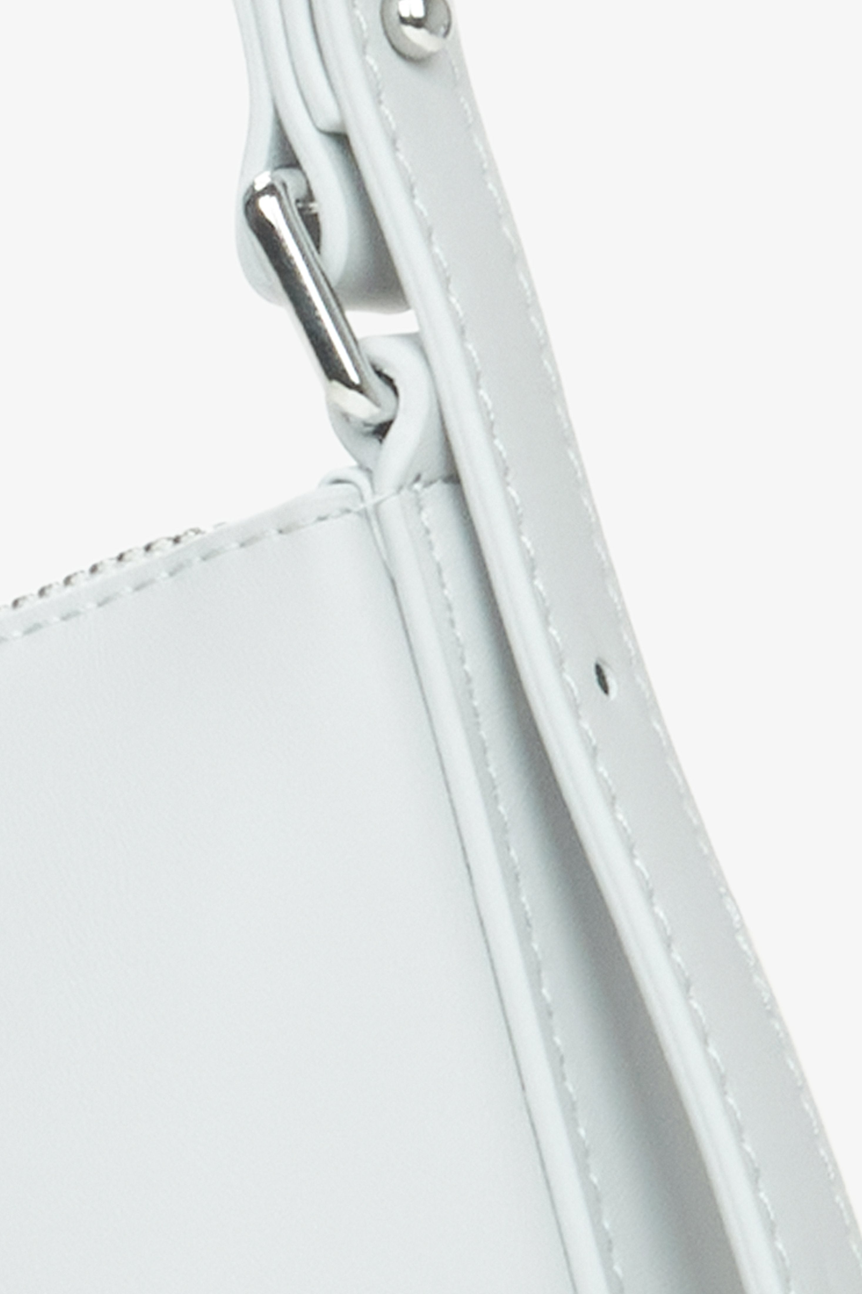 Women's light grey baguette bag -  a close-up on details.