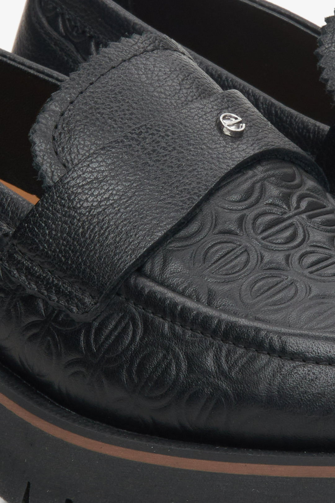 Women's black leather loafers by Estro - close-up on the details.