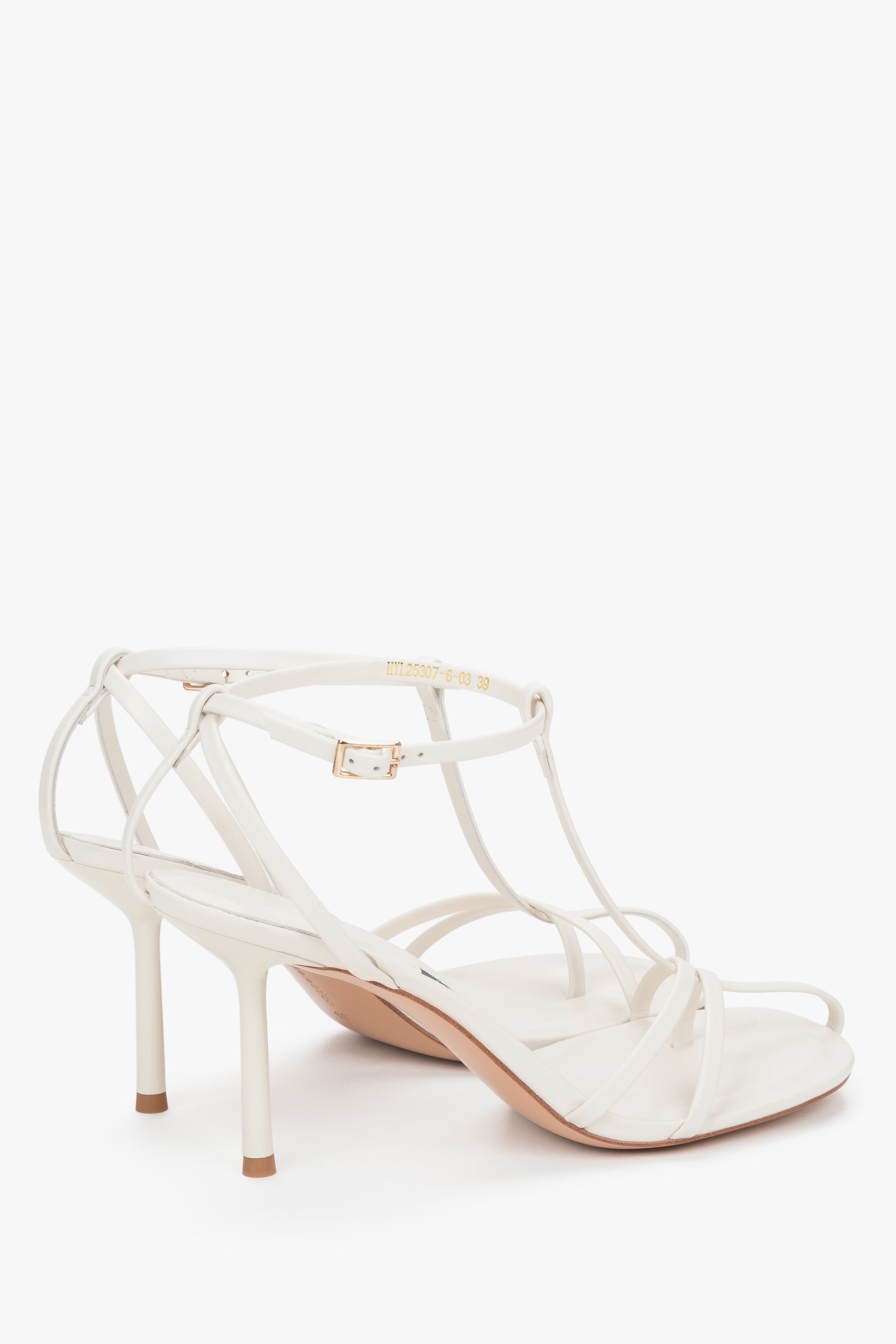 Angled product view of cream beige leather stiletto sandals by Estro Selection