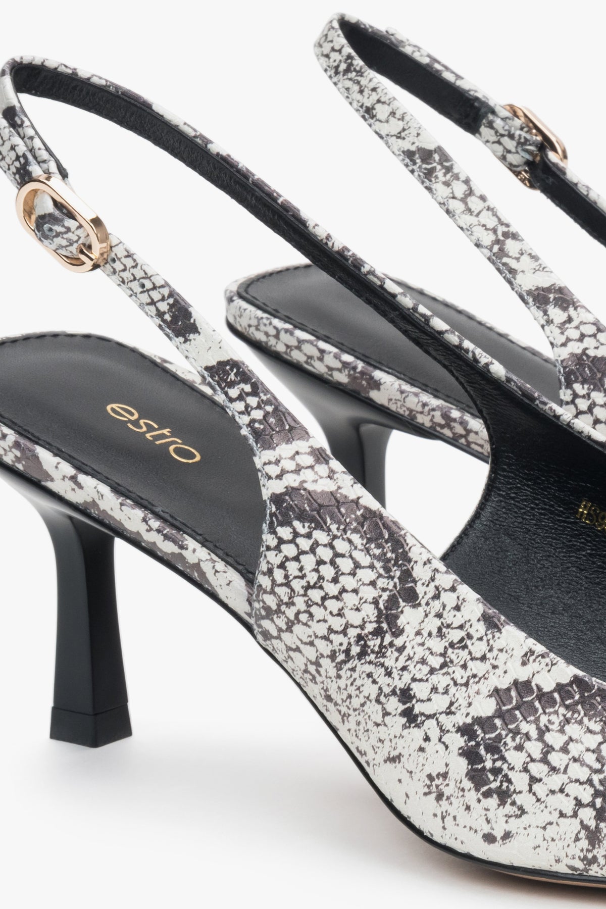 Black and grey women's slingback pumps made of leather by estro, featuring a snakeskin pattern – details.