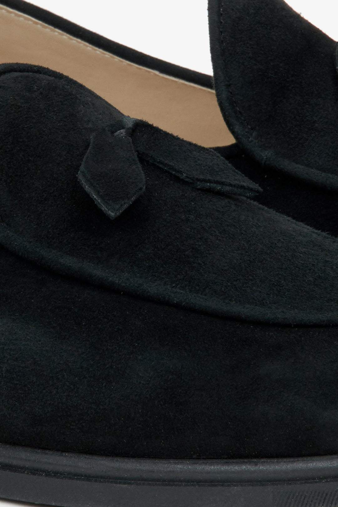 Women's black velour moccasins by Estro - close-up on details.
