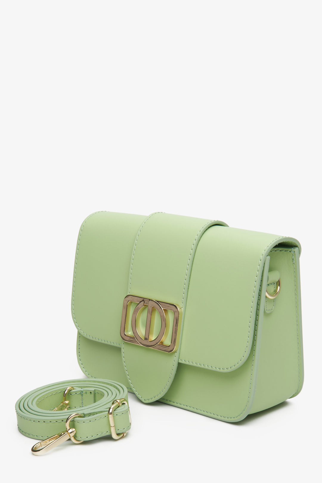 Green leather women's handbag with gold accents by Estro.