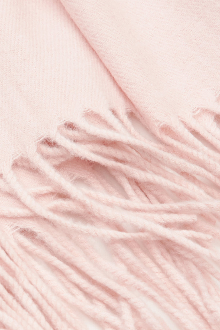 Soft light pink women's scarf by Estro with fringes.