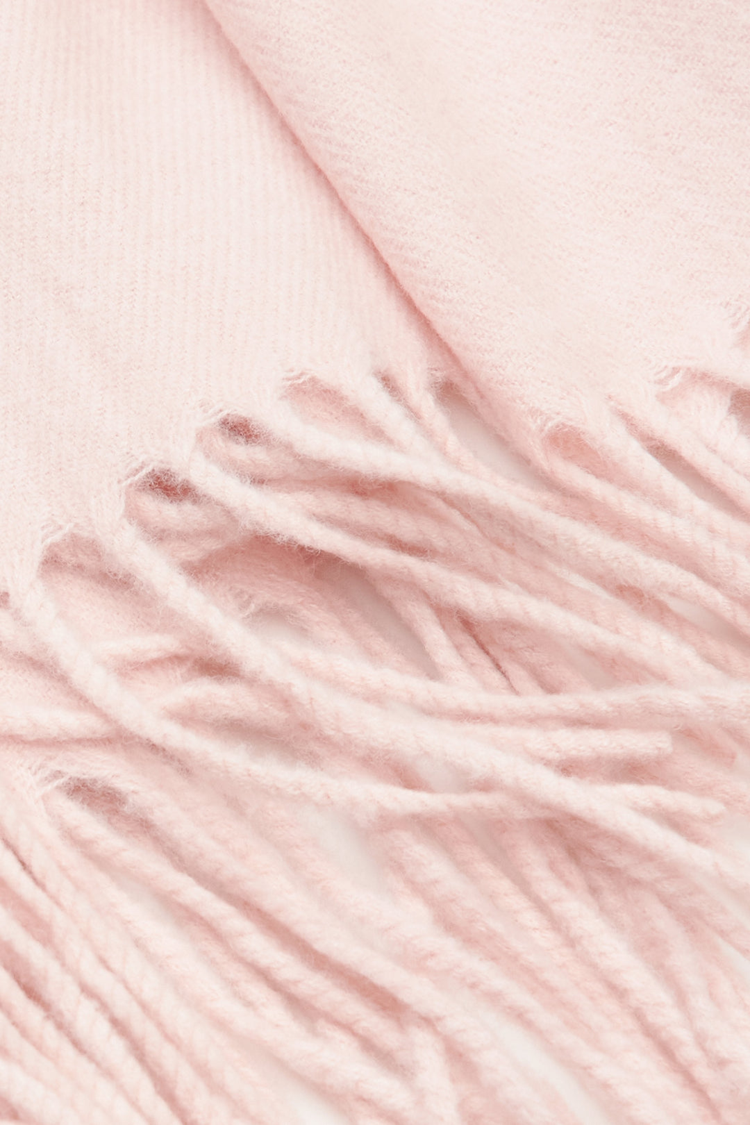 Soft light pink women's scarf by Estro with fringes.