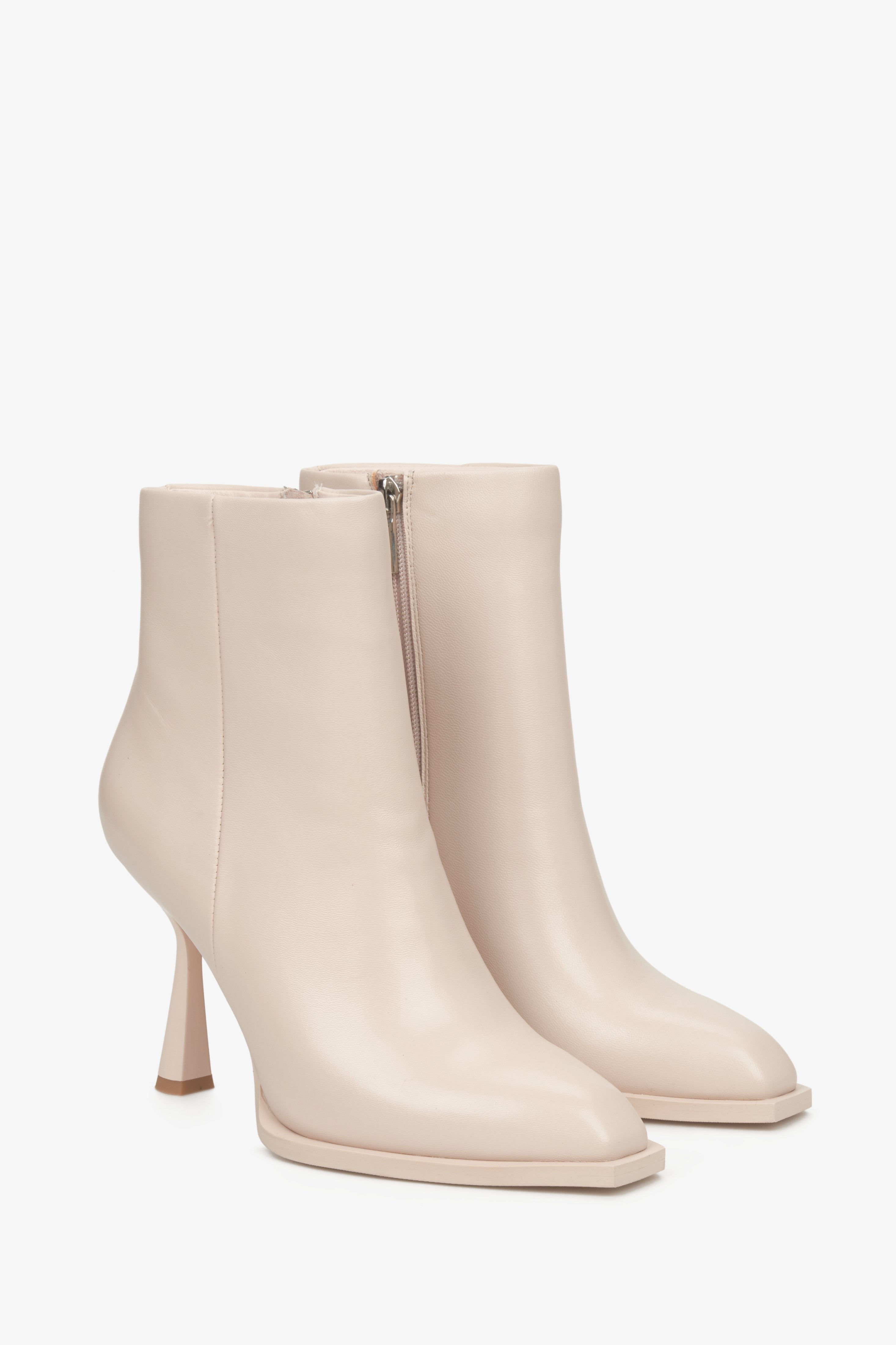 Women's beige high leather stiletto boots.