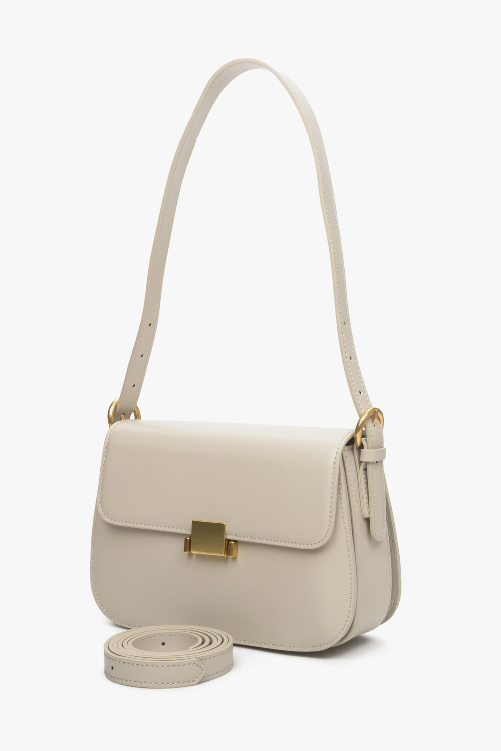 Women's light beige handbag made of genuine leather with gold accents by Estro.
