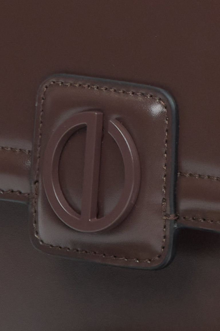 Small dark brown leather handbag by Estro - close-up of the detail.