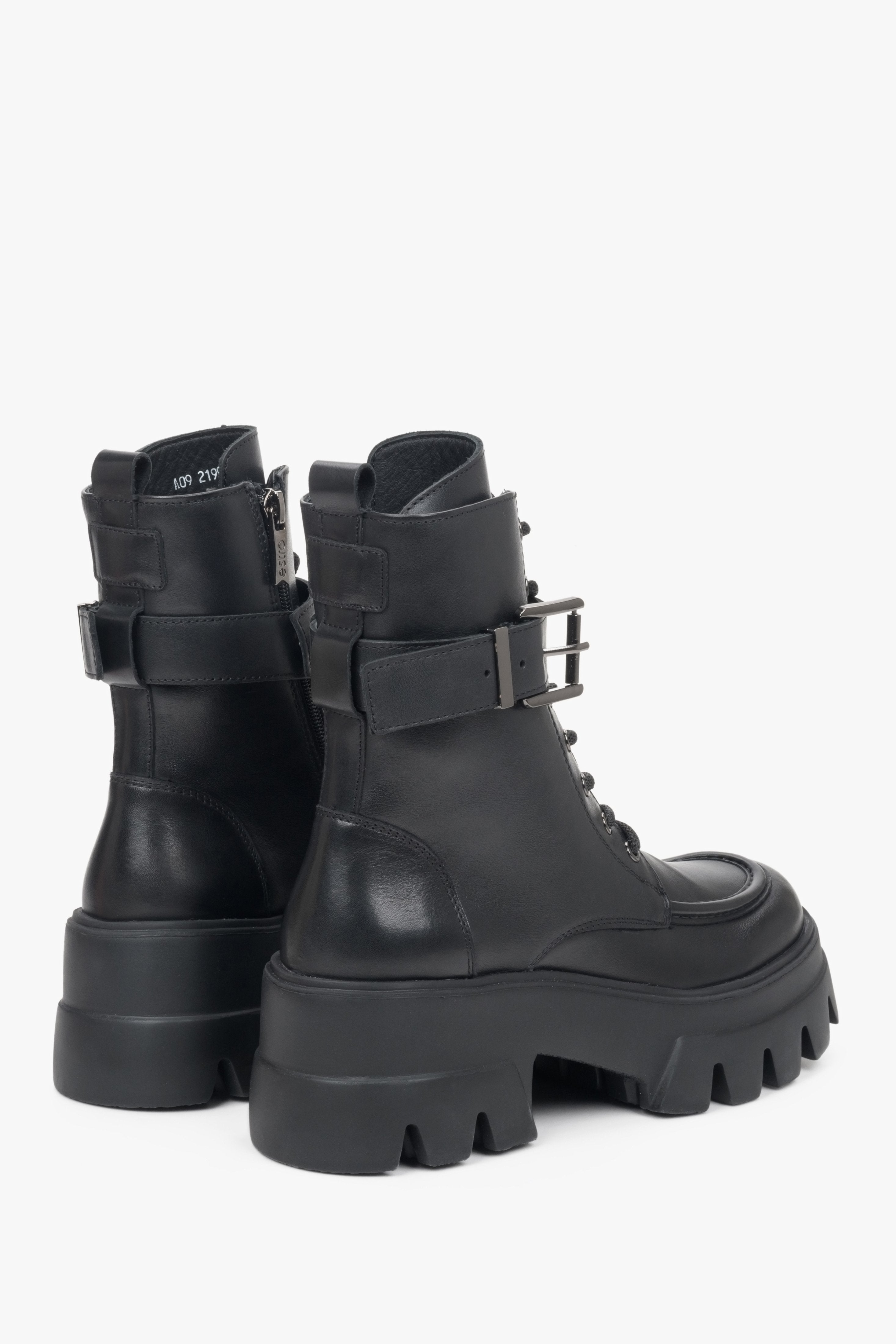 Black leather women's ankle boots with a buckle by Estro - close-up on the back of the boot and the side seam.