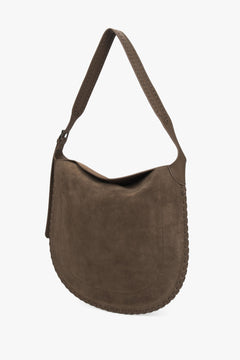 A women's shoulder bag in dark beige, crafted from genuine natural suede.