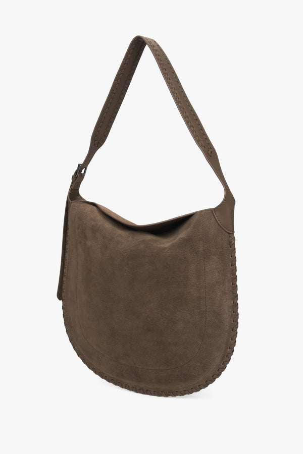 A women's shoulder bag in dark beige, crafted from genuine natural suede.