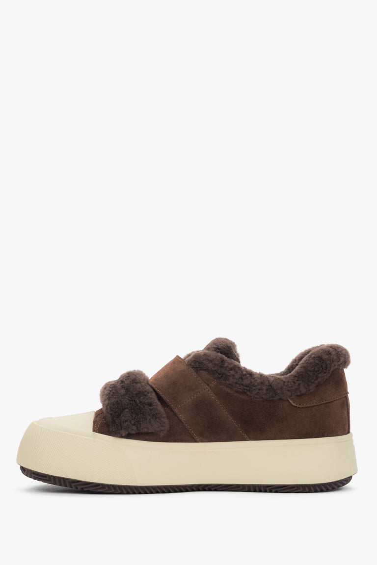 A pair of women's low-top sneakers in dark brown, crafted from genuine velour with a warm fur lining.