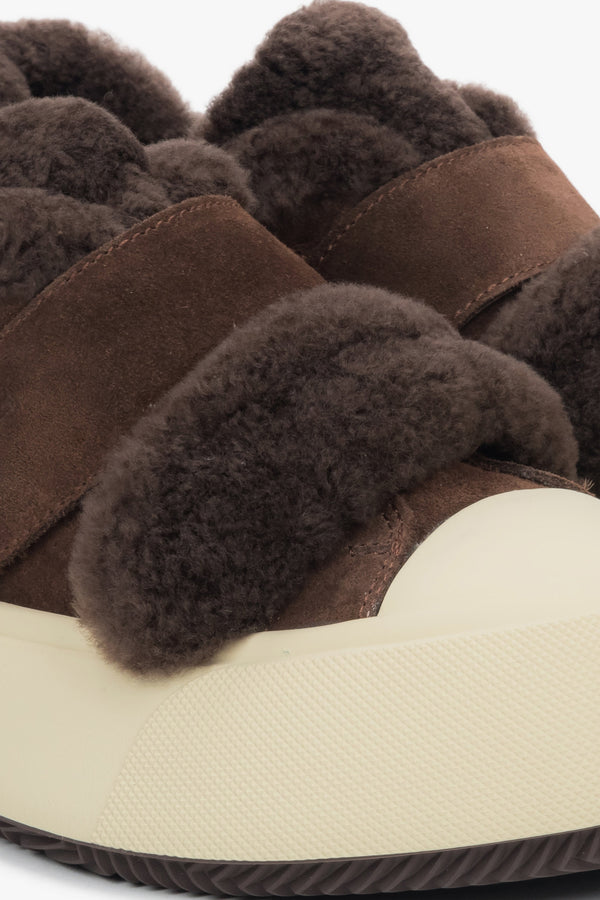 Women's dark brown low-top sneakers featuring a genuine velour upper and a cozy fur lining.