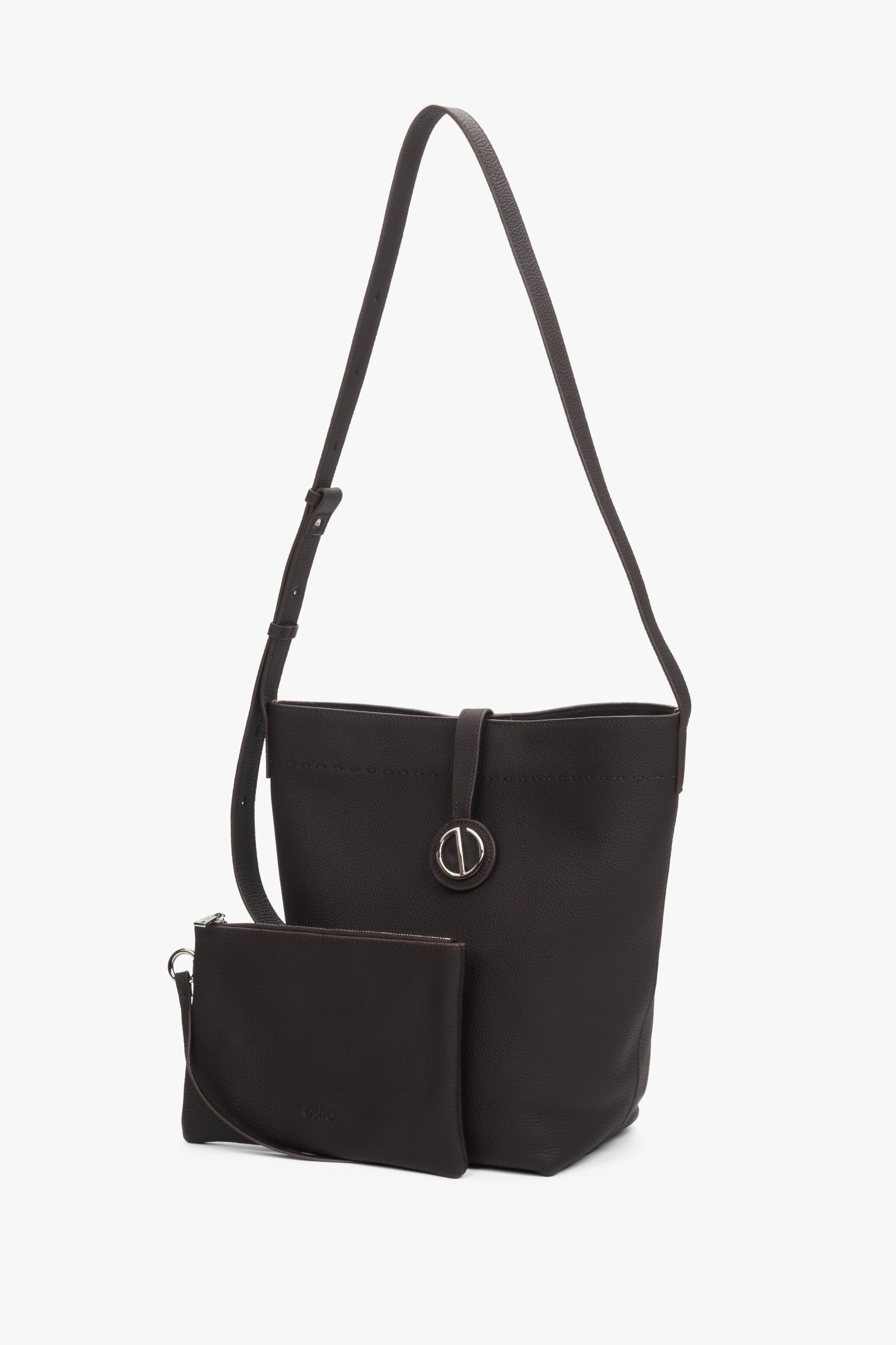 Women’s dark brown leather bucket bag with a removable cosmetic pouch.