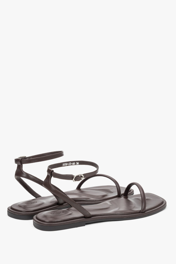 Minimalist dark brown sandals made of genuine leather with thin straps, designed for comfort.