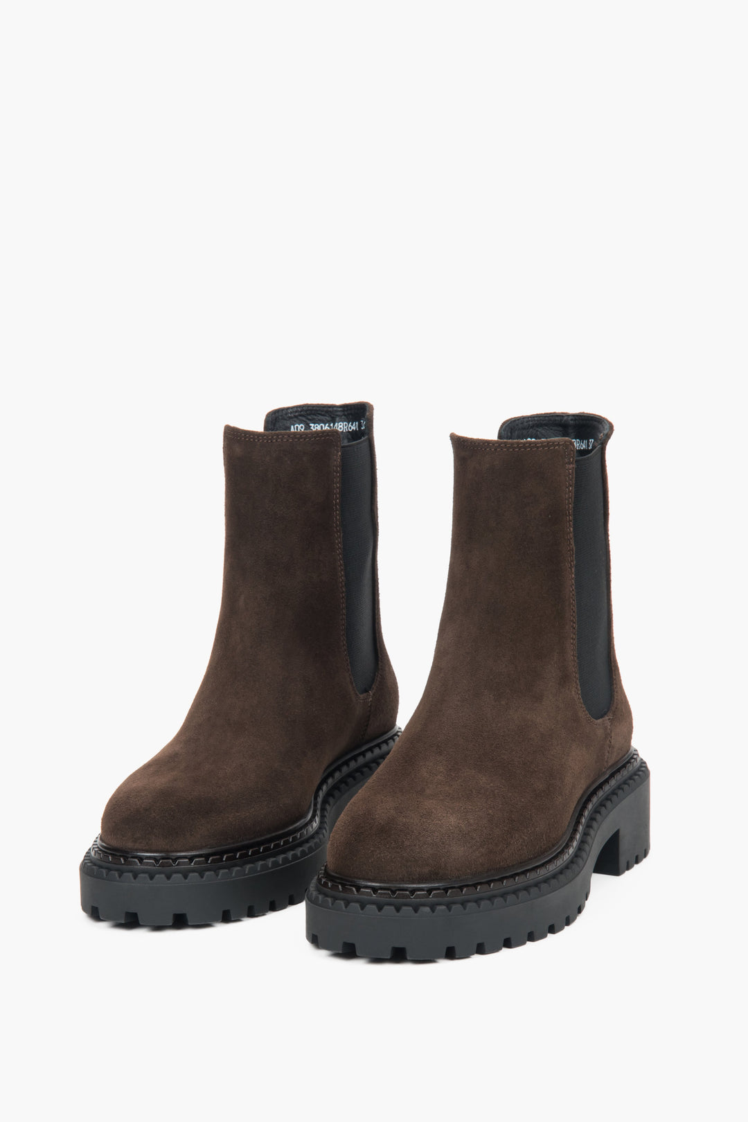 A pair of dark brown women's Chelsea boots with a platform sole and an Italian velour upper.