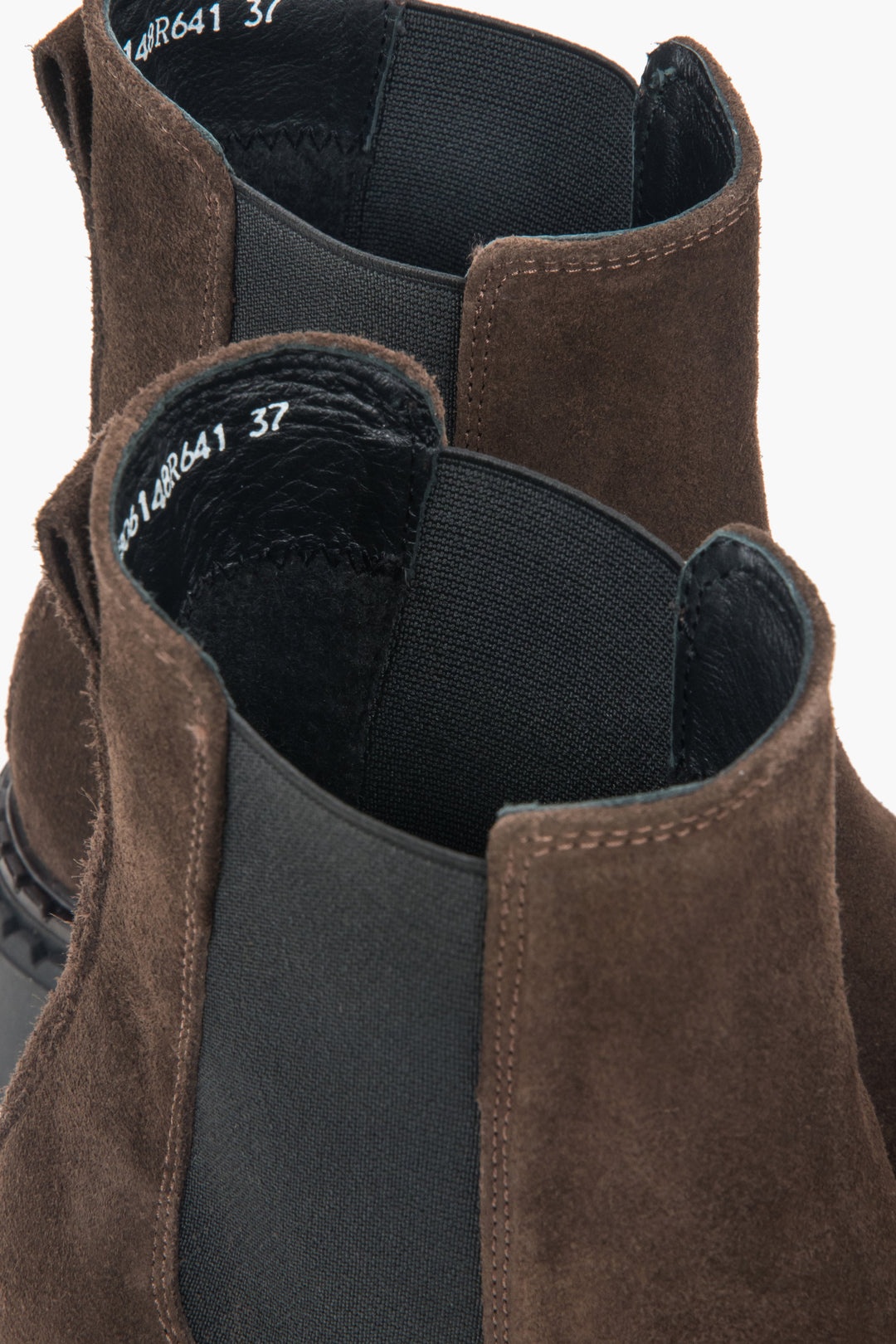 A pair of genuine Italian velour Chelsea boots for women in dark brown with a thick platform sole.