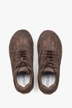 Women's dark brown low-top sneakers crafted from a blend of velour and textile materials.