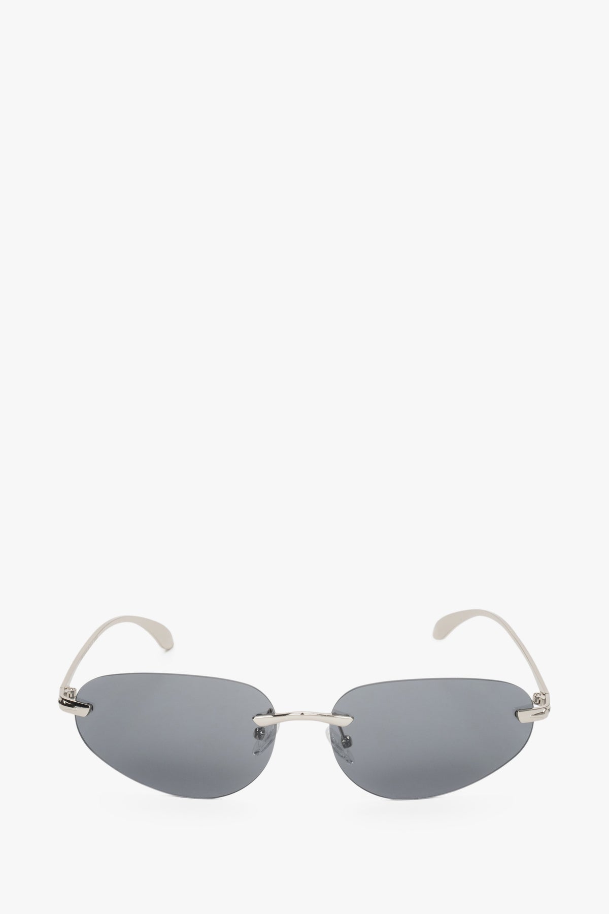 Dark grey narrow sunglasses for women with a rimless design.