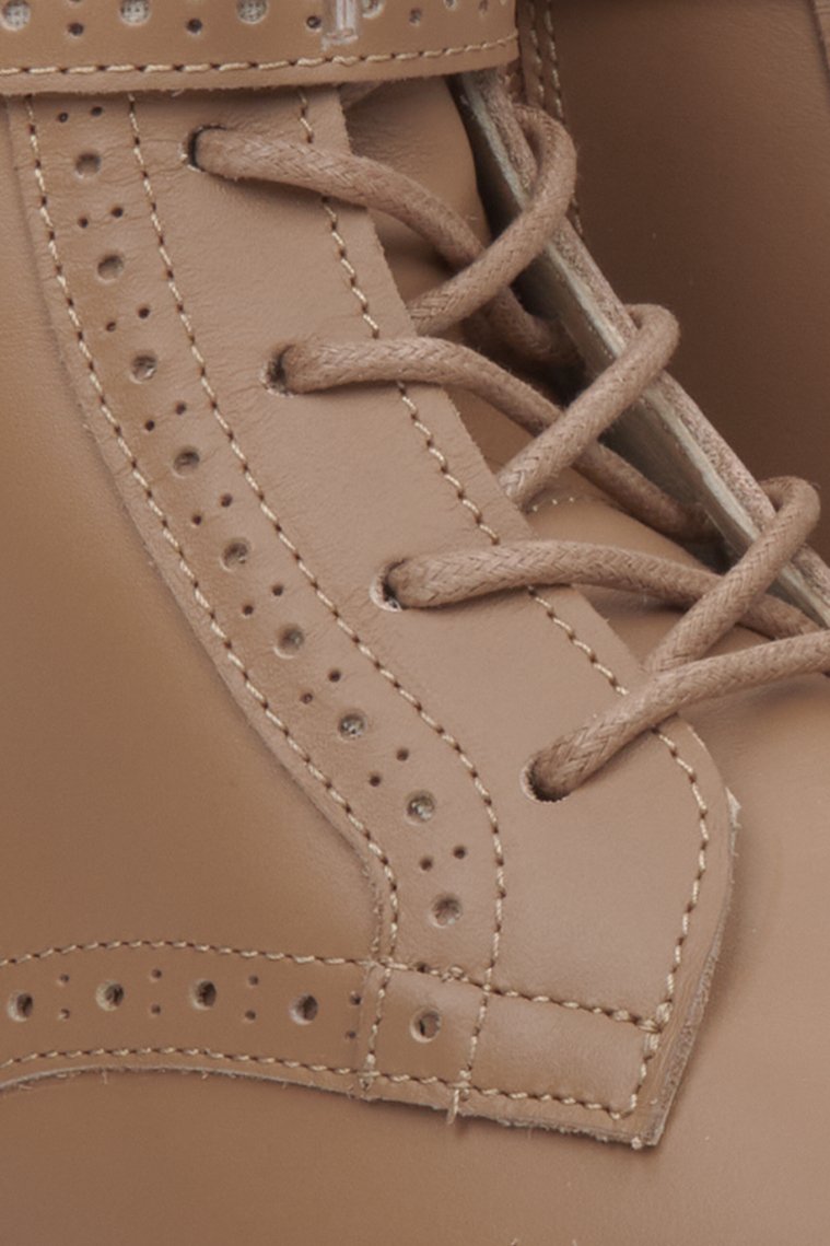 High brown leather women's combat boots by Estro - close-up of the lacing system.