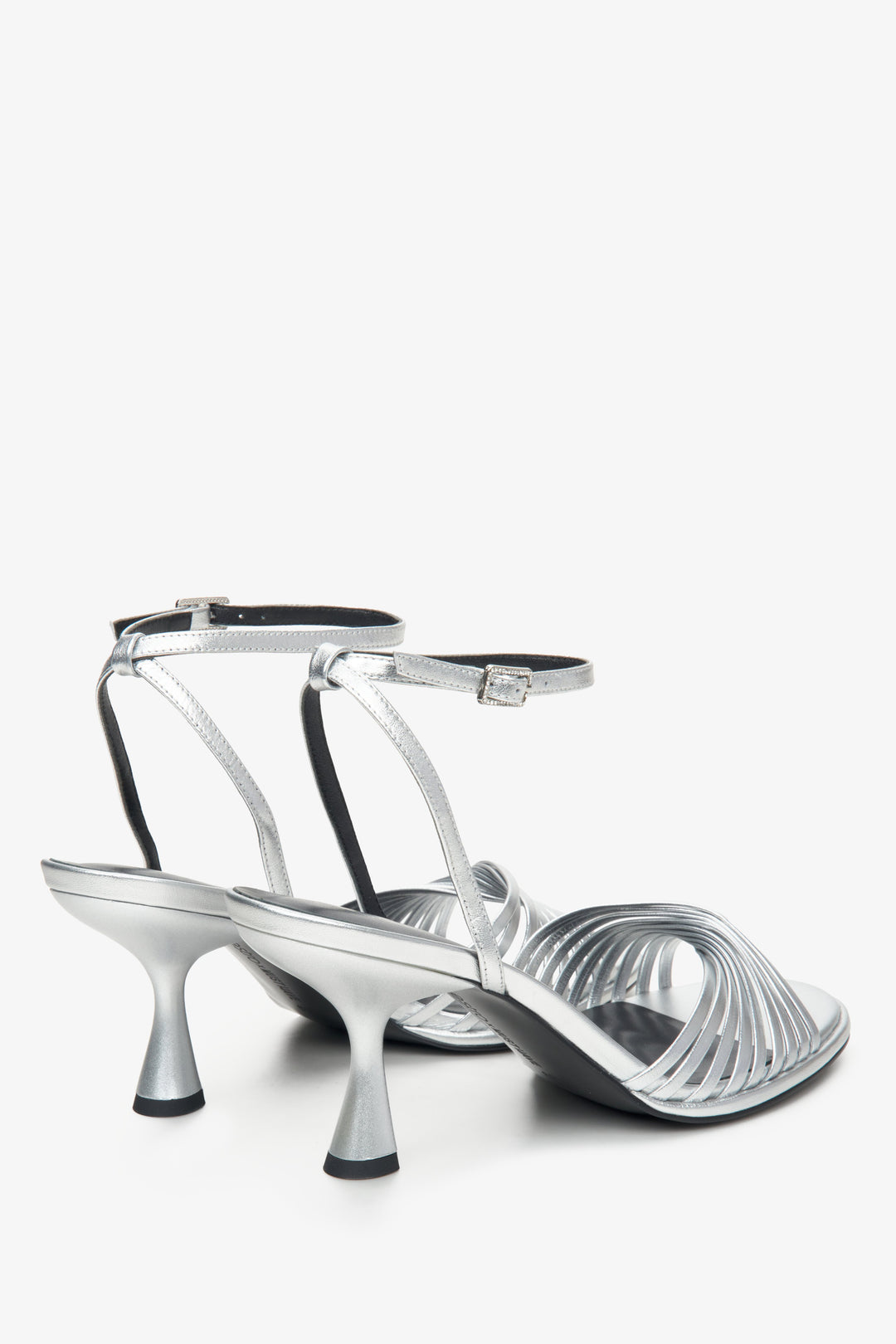 Comfortable silver women's sandals with heels made of genuine leather by Estro x MustHave - close-up on the heel and side line of the shoe.