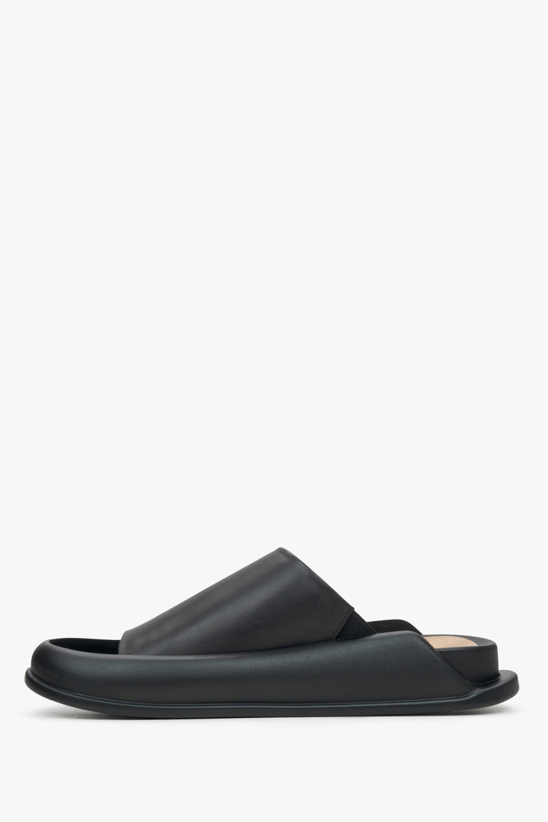 Women's black slide sandals made of soft genuine leather by Estro - shoe profile.