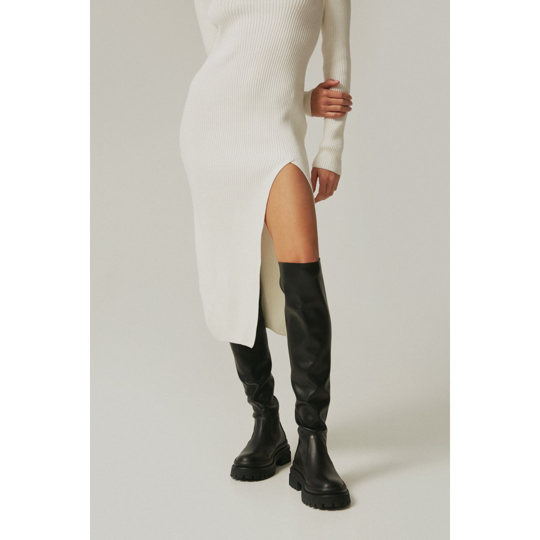 Black knee-high women's boots - presentation on a model.