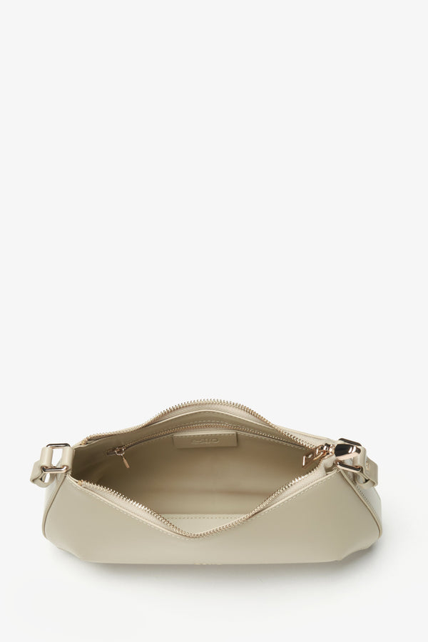 Women's beige leather handbag - a close-up on the main compartment.