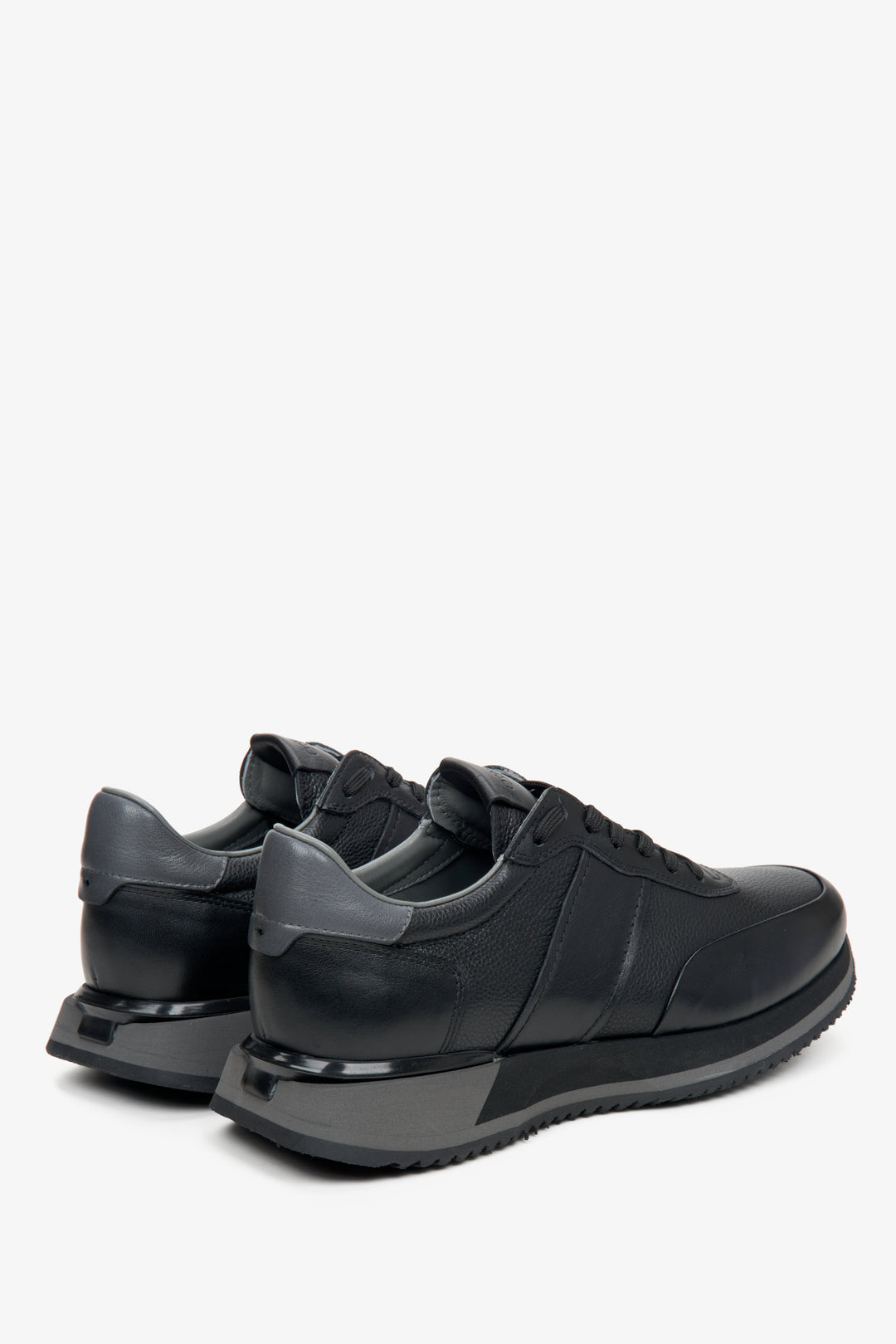 Men's black leather sneakers by Estro - close-up on the side line and heel.