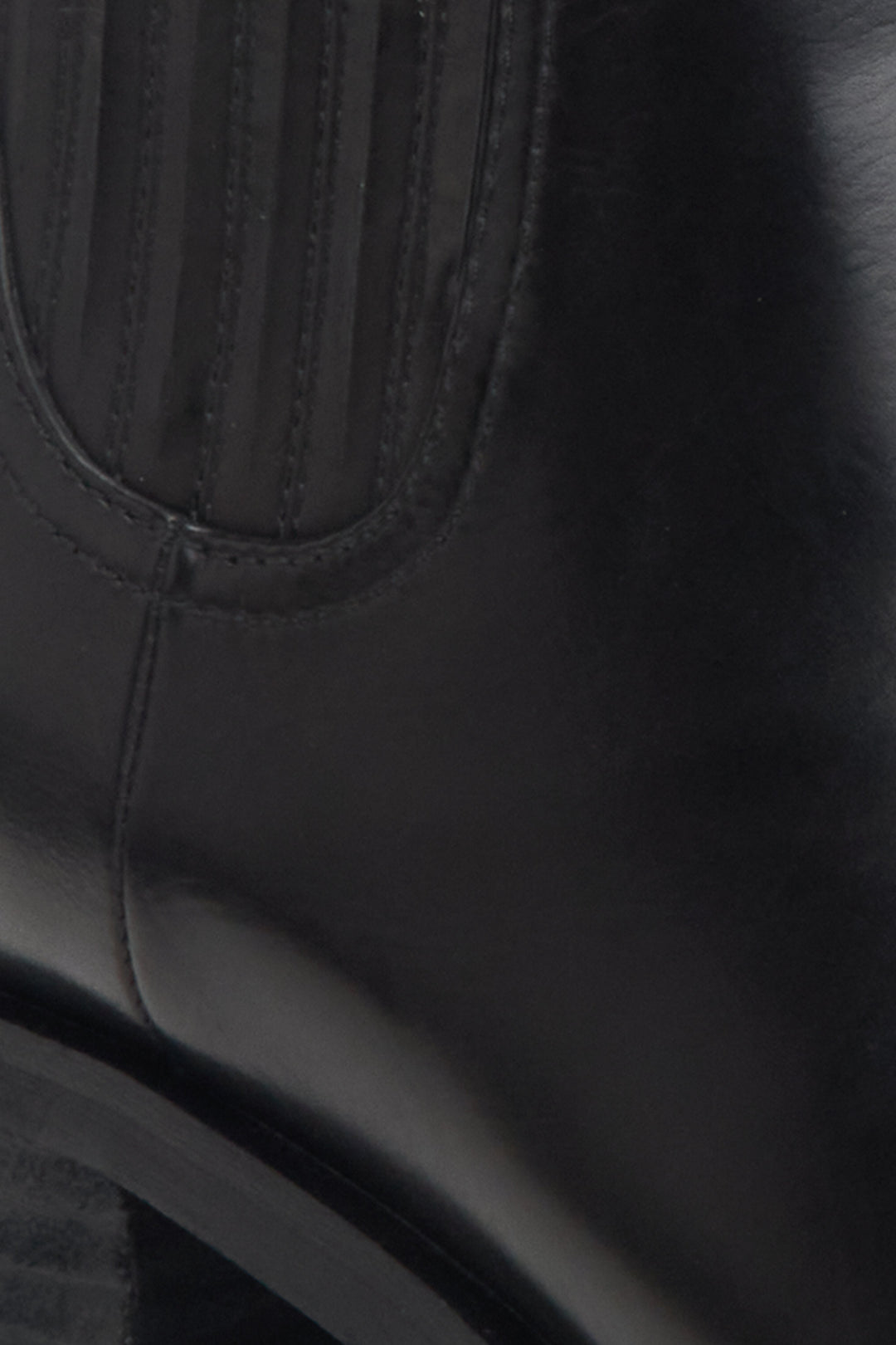 Women's black chelsea boots - close-up on details.