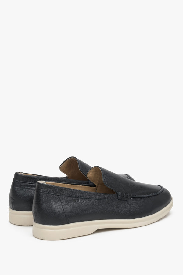 Elegant black leather loafers for her - presentation of a shoe toe and sideline.