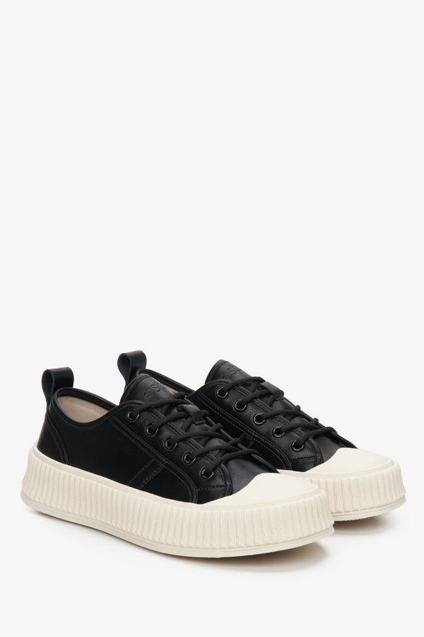 Women's black fall sneakers made of genuine leather with a white sole.