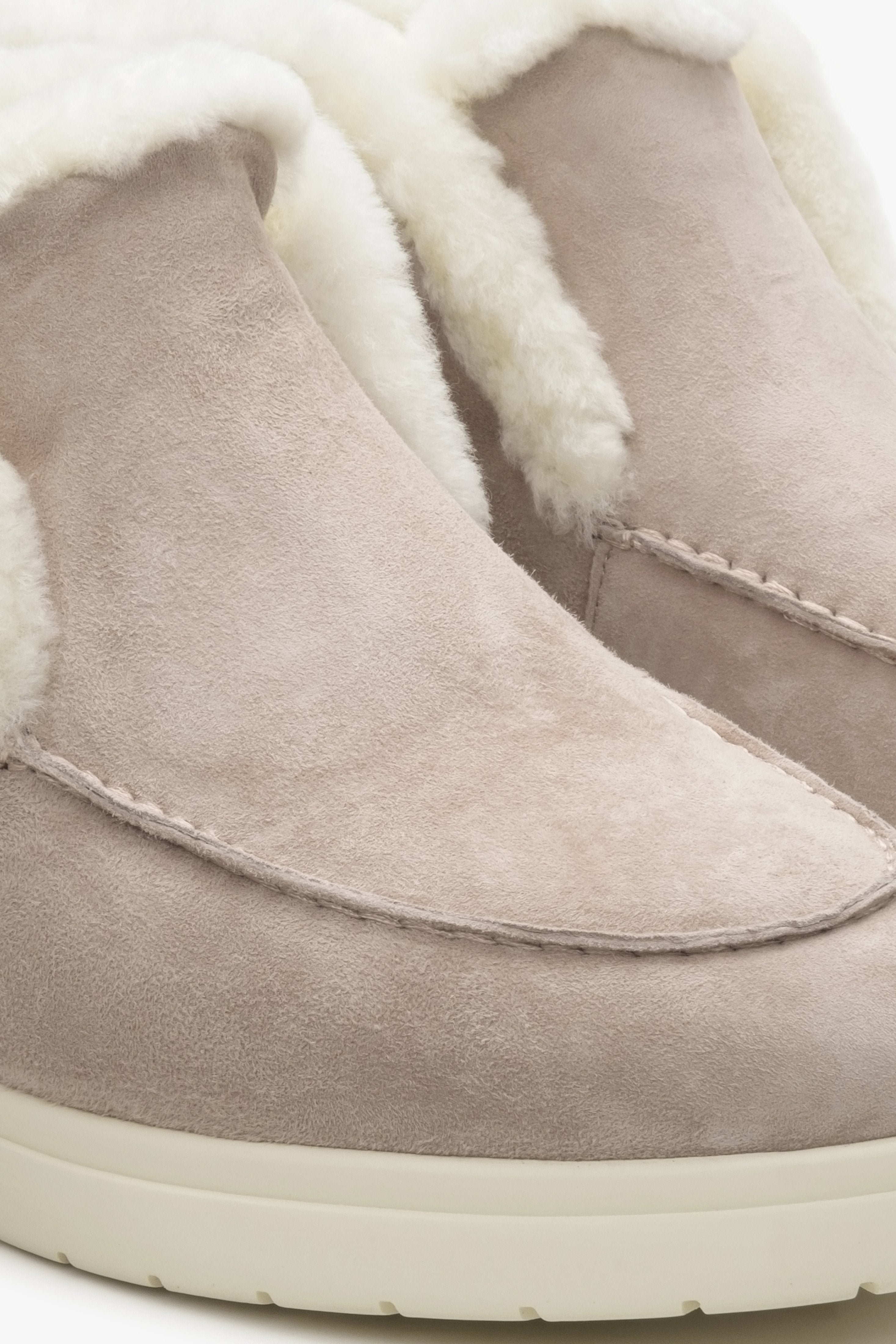 Women's fur and velour ankle boots in pale pink colour.