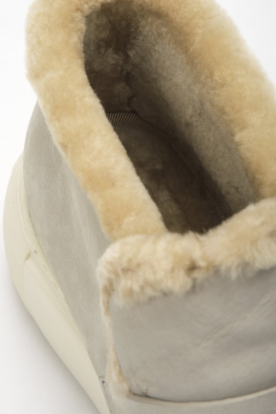 Grey low women's ankle boots Estro with fur made of nubuck - close-up of the decorative application.