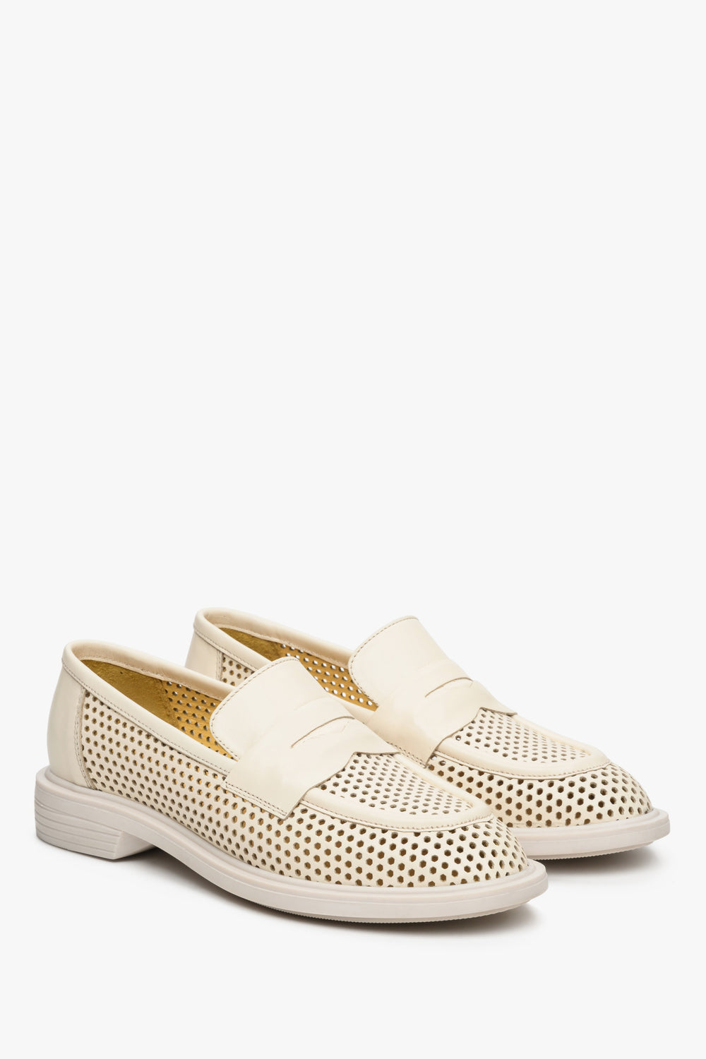 Women's light beige fall/spring loafers with perforation -presentation of the toe and side vamp.