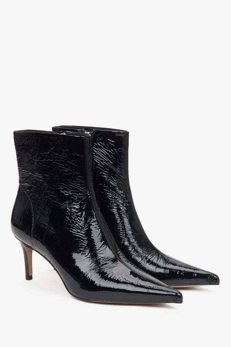 Black patent ankle boots for women by Estro with a stiletto heel.