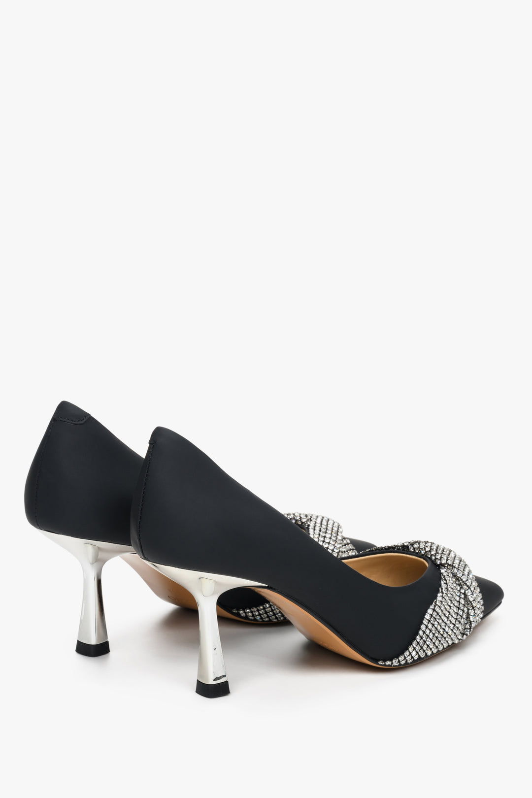 Women's black leather stilettos with silver accents by Estro.