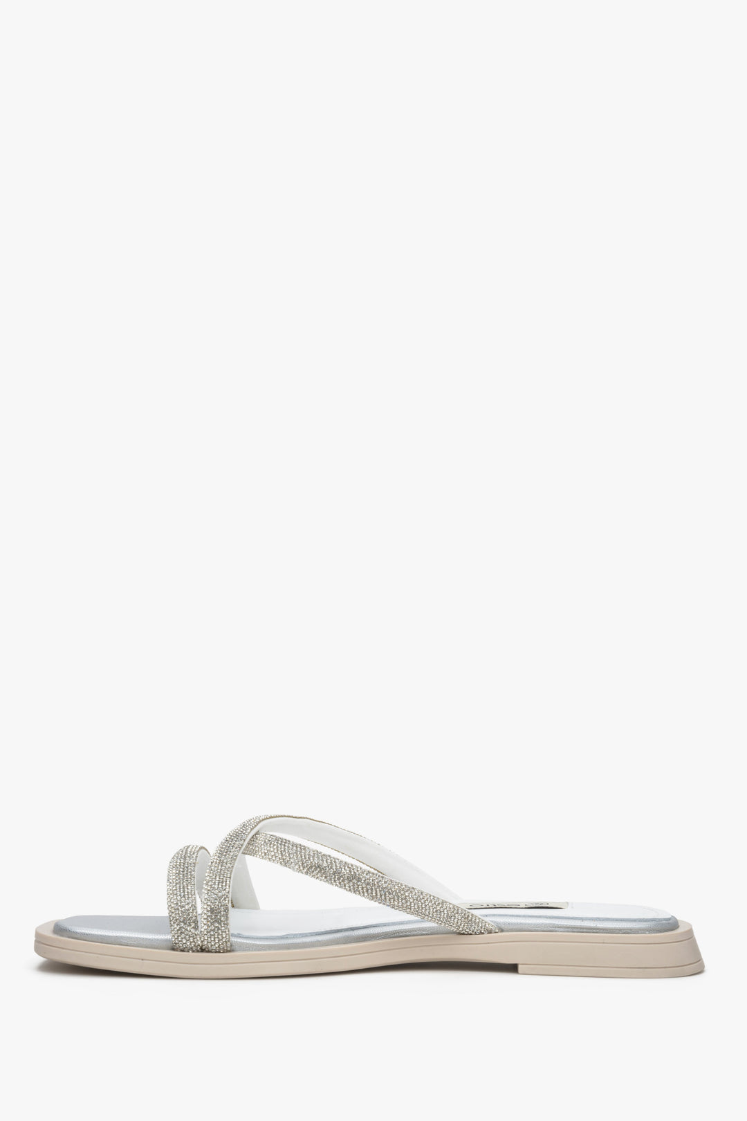 Silver women's slide sandals with thin crossed straps and decorative zirconia.