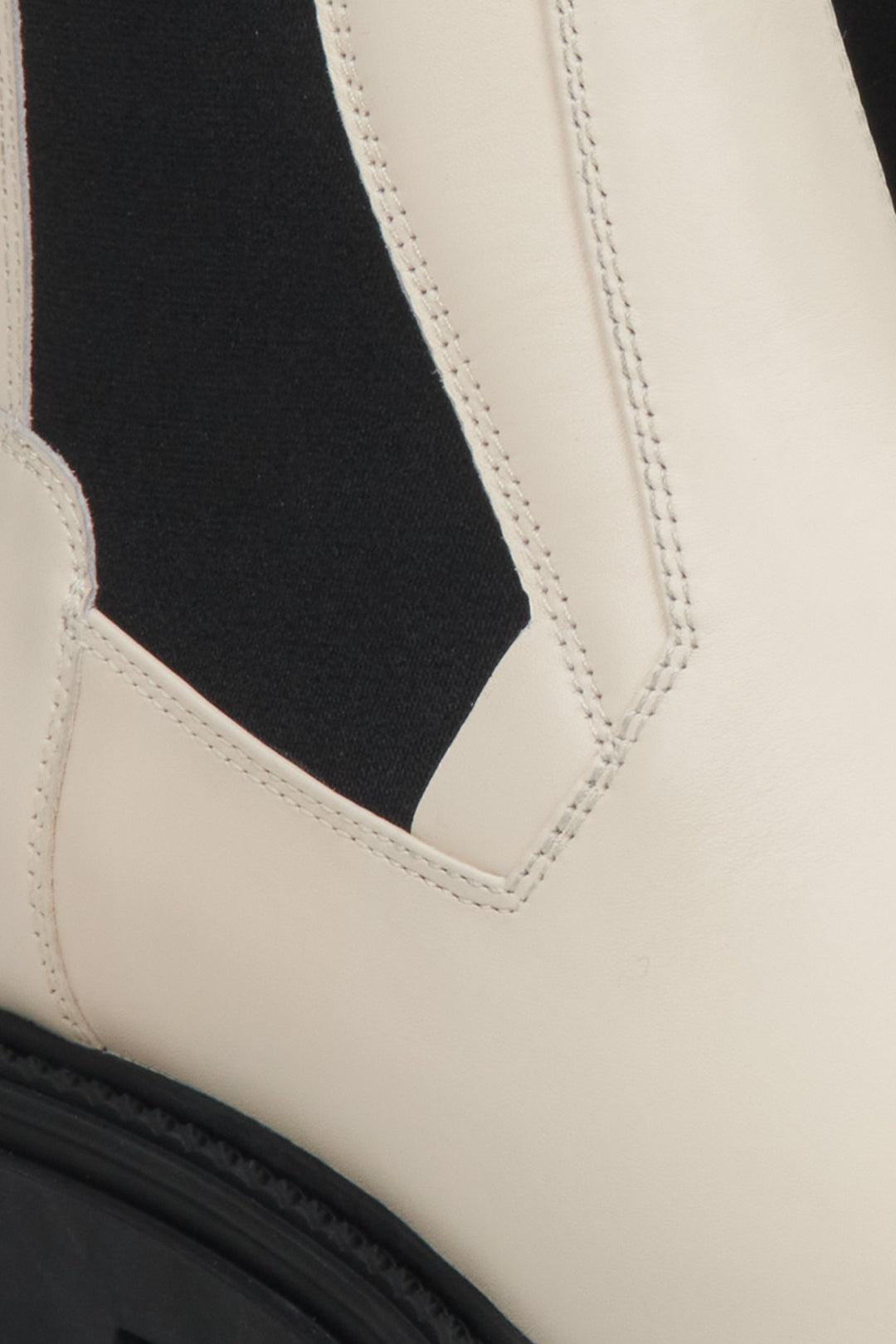 Women's beige and black leather Chelsea boots - a close-up on details.