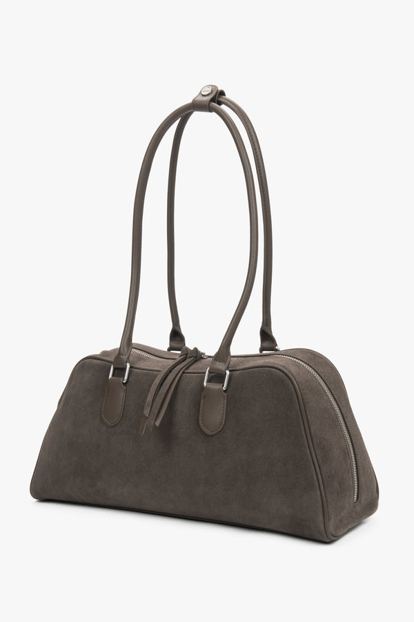 A shoulder bag for women by Estro in beige and grey velour, featuring long handles.